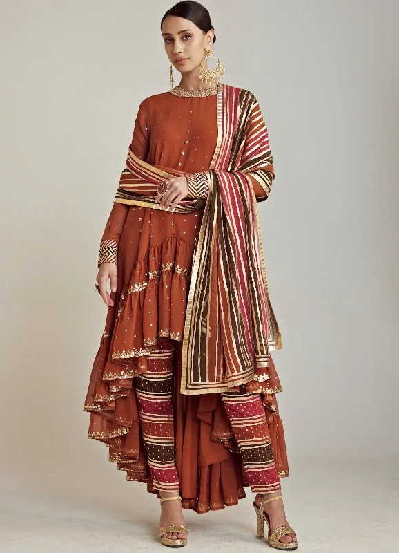 Rust Round Neck Asymmetrical Kurta Pant Set With Georgette Dupatta Trendy Printed Pants Rust Round Neck Asymmetrical Kurta Pant Set With Georgette Dupatta Trendy Printed Pants