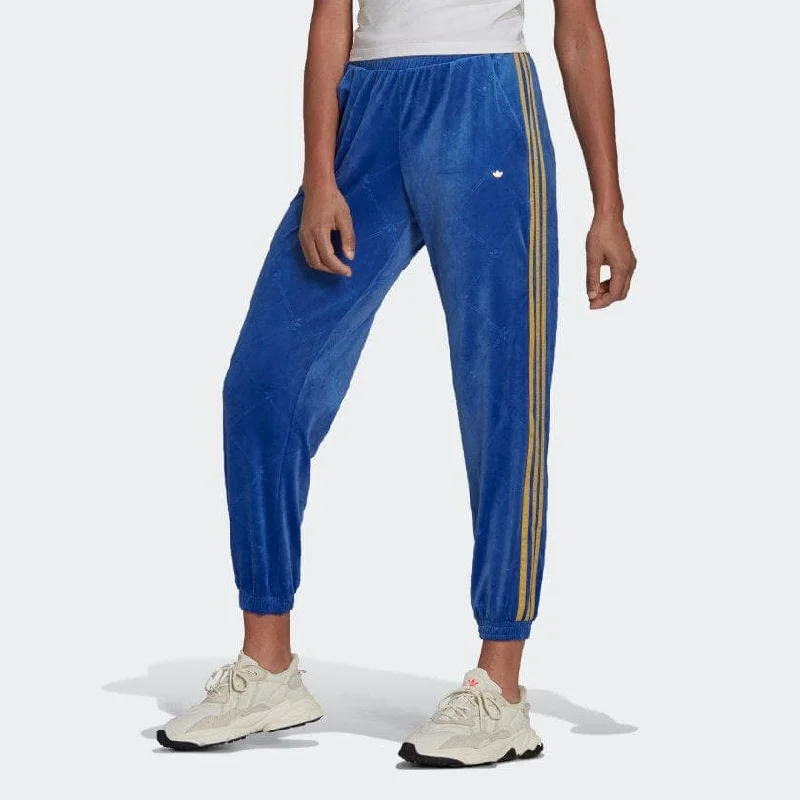 TRACK PANTS IN VELVET WITH EMBOSSED ADIDAS ORIGINALS MONOGRAM AND GOLD STRIPES Comfortable Denim Pants
